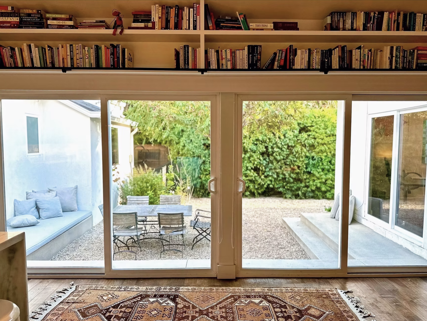 Outdoor living space surrounded by native plants